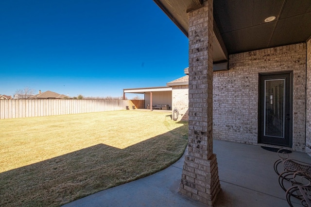 view of yard with a patio and a fenced backyard