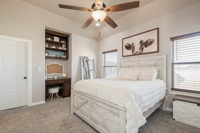 bedroom with a ceiling fan, carpet, and baseboards