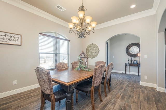 dining space featuring arched walkways, crown molding, visible vents, dark wood-type flooring, and baseboards