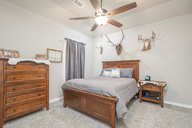 bedroom with baseboards, ceiling fan, visible vents, and light colored carpet