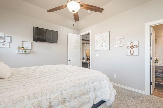 carpeted bedroom with a ceiling fan and baseboards