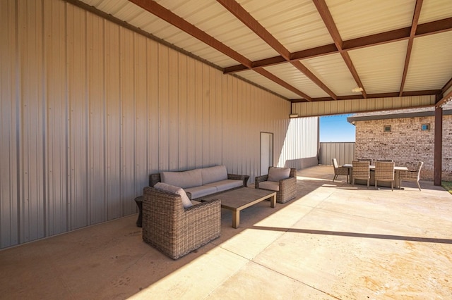 view of patio / terrace featuring outdoor dining area, fence, and an outdoor hangout area