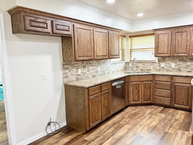 3612 Oakridge Dr, Midland, TX 79707 - kitchen featuring dishwasher, light wood-type flooring, light stone countertops, ornamental molding, and tasteful backsplash