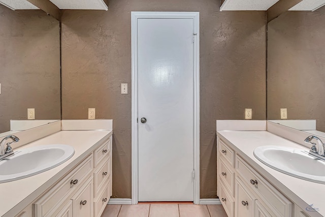 bathroom with vanity and tile patterned flooring