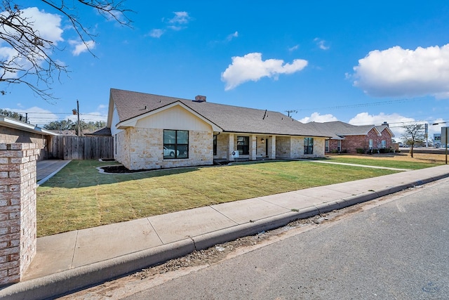 ranch-style house with a front yard