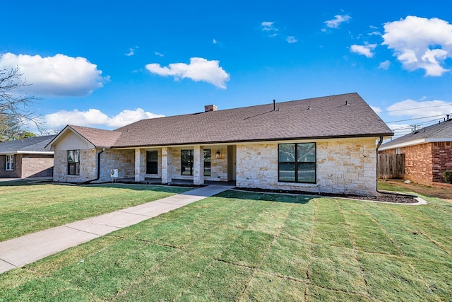 ranch-style house featuring a front lawn