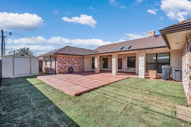 back of property featuring a shed, a patio, and a lawn