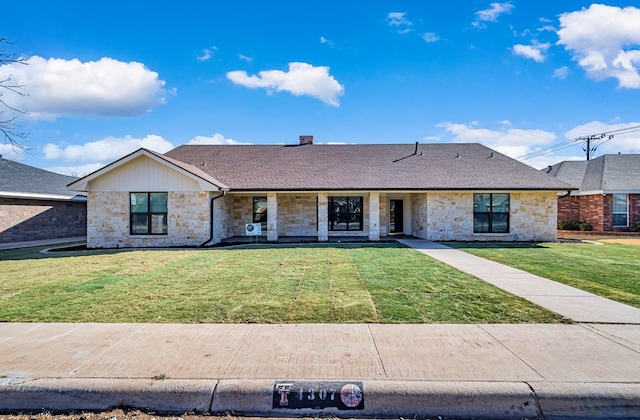 ranch-style house featuring a front yard