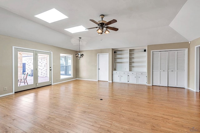 unfurnished living room featuring vaulted ceiling, ceiling fan, and light wood-type flooring