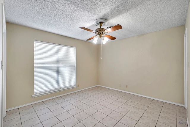 empty room with a textured ceiling and ceiling fan