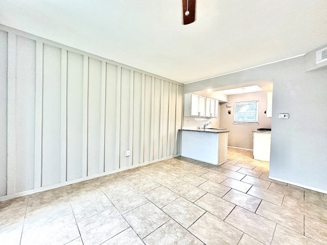 501 W Scharbauer Dr Unit 28, Midland, TX 79705 - interior space featuring a sink and light tile patterned floors