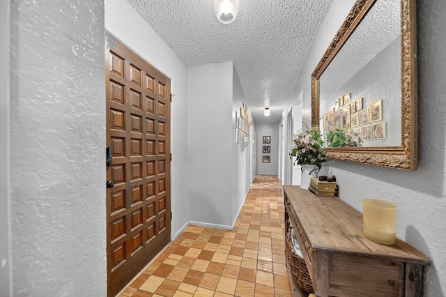 2608 Emerson Dr, Midland, TX 79705 - hallway featuring a textured ceiling and a textured wall