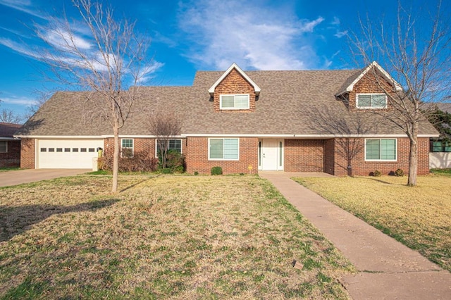 1702 Cessna Dr, Midland, TX 79705 - view of front of house featuring a garage, brick siding, driveway, and a front lawn