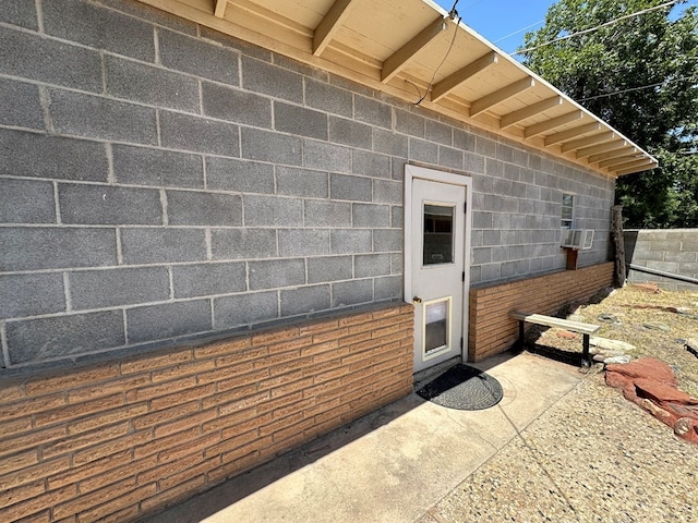 property entrance featuring cooling unit