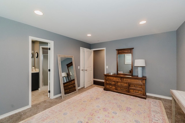 3300 Cambridge St, Odessa, TX 79761 - carpeted bedroom with recessed lighting and ensuite bath