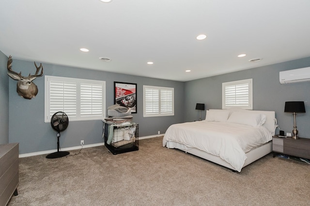 3300 Cambridge St, Odessa, TX 79761 - carpeted bedroom featuring a wall mounted AC and recessed lighting