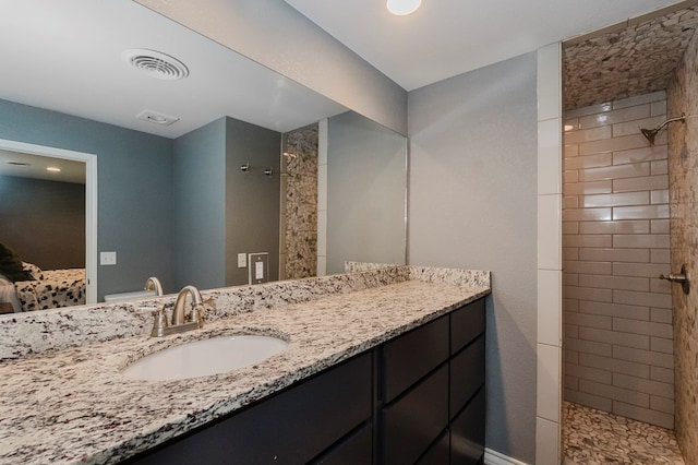 3300 Cambridge St, Odessa, TX 79761 - bathroom featuring a walk in shower and vanity