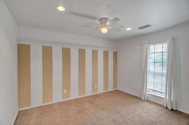 105 Maple Ave, Coahoma, TX 79720 - unfurnished room with light carpet, a ceiling fan, recessed lighting, and baseboards