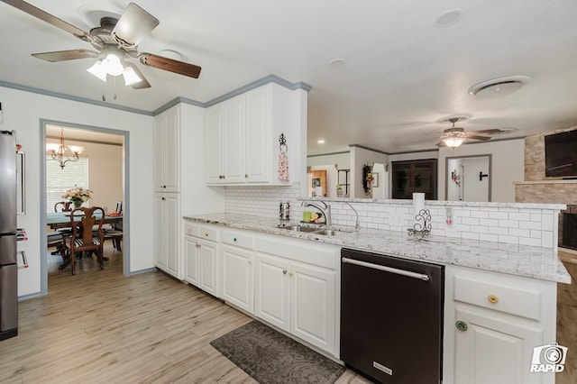 3228 W Dengar Ave, Midland, TX 79705 - kitchen with dishwasher, ceiling fan, a sink, decorative backsplash, and a peninsula