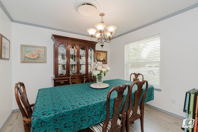 3228 W Dengar Ave, Midland, TX 79705 - dining area featuring light wood-type flooring, ornamental molding, a chandelier, and baseboards