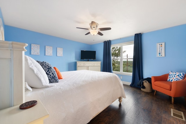 bedroom featuring ceiling fan and dark wood-type flooring