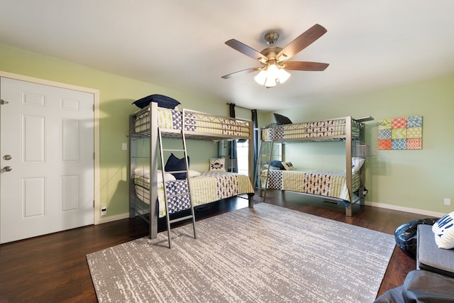 bedroom featuring dark hardwood / wood-style flooring and ceiling fan