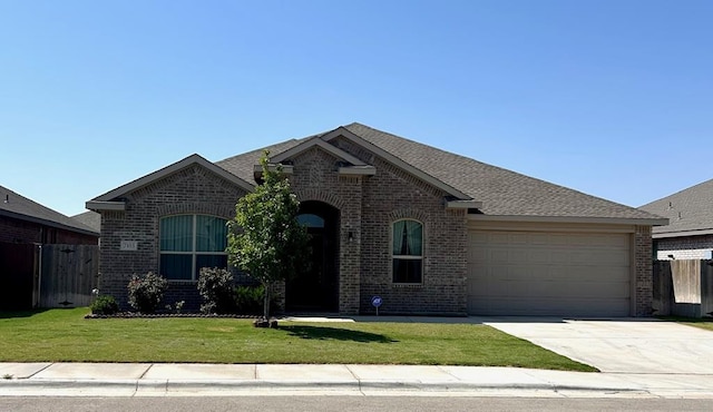 7103 Mcpherson Ln, Midland, TX 79706 - view of front of home featuring brick siding, a garage, and driveway