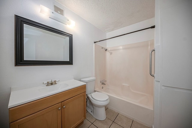 full bathroom featuring vanity,  shower combination, tile patterned flooring, toilet, and a textured ceiling