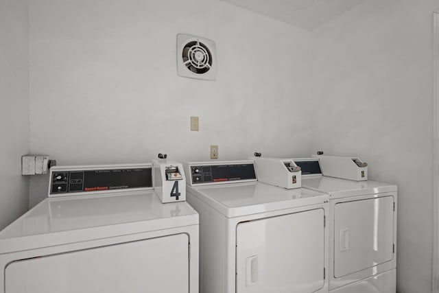 laundry room featuring separate washer and dryer