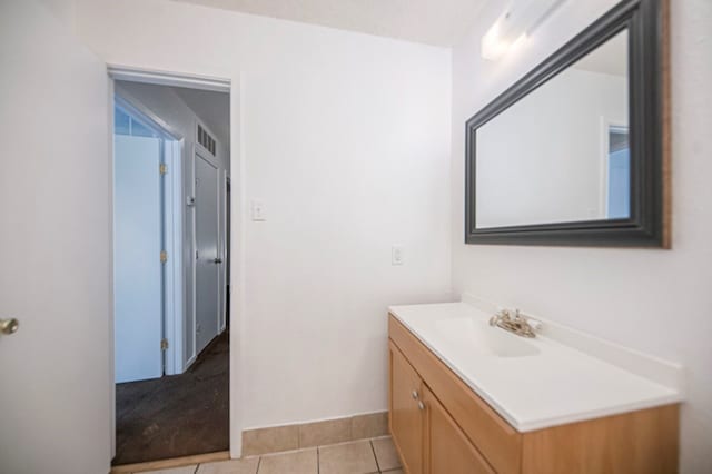 bathroom featuring tile patterned flooring and vanity