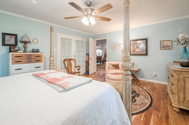 bedroom featuring ceiling fan, a textured ceiling, and ornamental molding