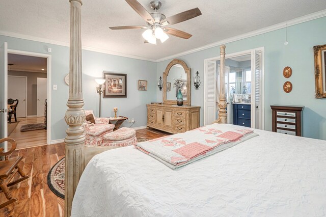 bedroom with ceiling fan, ornamental molding, and a textured ceiling