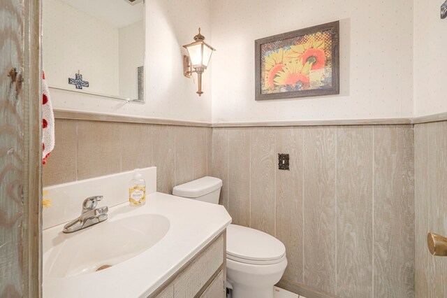 bathroom featuring toilet and vanity