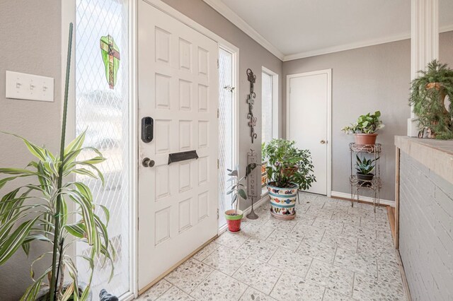 entrance foyer featuring crown molding