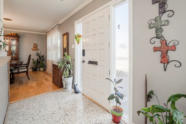 entrance foyer with crown molding and light wood-type flooring