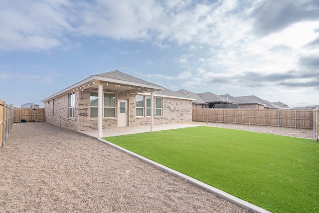 7318 Cross B Rd, Odessa, TX 79765 - rear view of property with brick siding, a patio area, and a fenced backyard