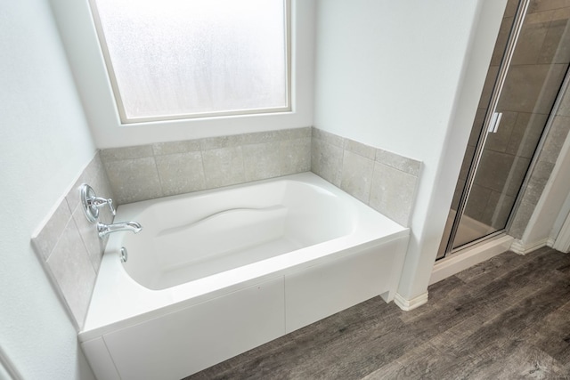 7318 Cross B Rd, Odessa, TX 79765 - bathroom with a garden tub, a shower stall, and wood finished floors