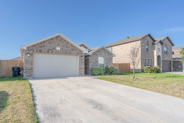 7318 Cross B Rd, Odessa, TX 79765 - view of front facade with brick siding, driveway, and an attached garage