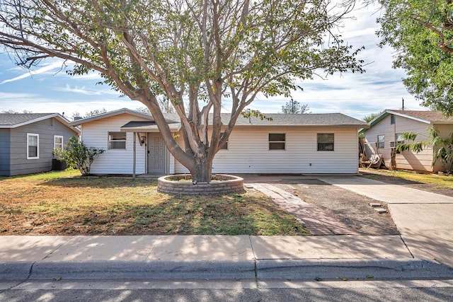 ranch-style home featuring a front yard