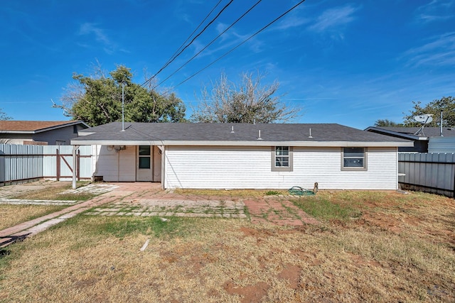 back of house with a yard