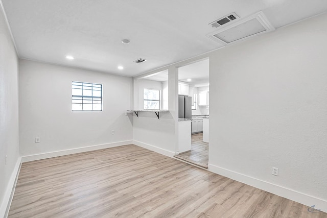 unfurnished room featuring light wood-type flooring