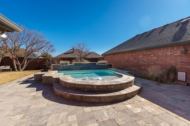 view of swimming pool with a patio area