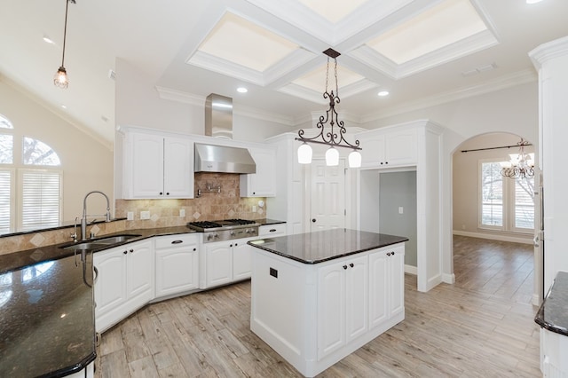 kitchen with white cabinetry, sink, pendant lighting, and stainless steel gas stovetop