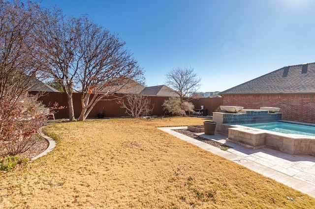 view of yard with a jacuzzi and a patio