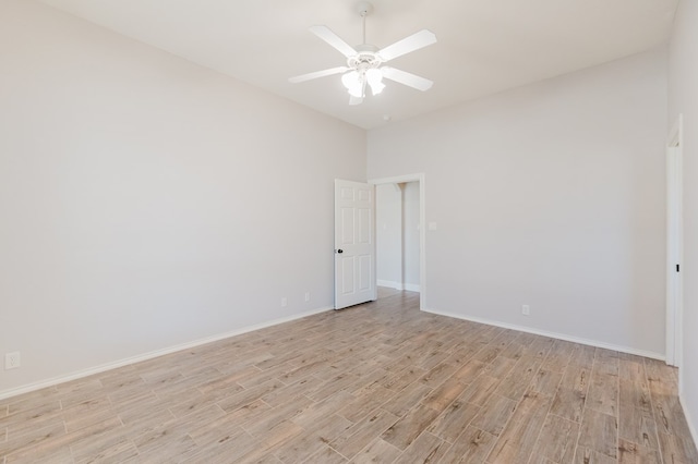 spare room featuring ceiling fan and light hardwood / wood-style flooring