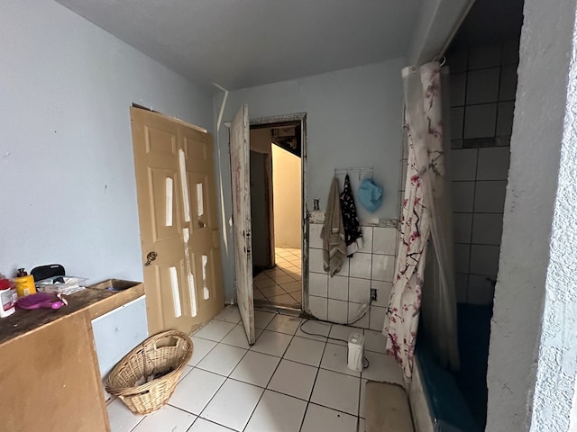 bathroom with tile patterned flooring