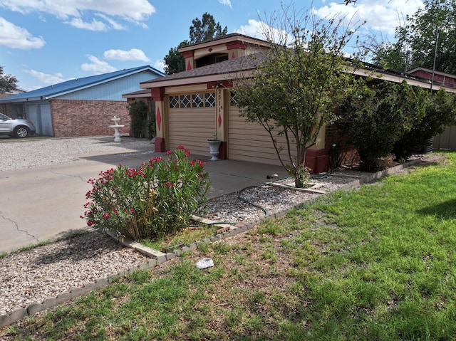 2511 Fontana St, Odessa, TX 79763 - view of front of home featuring driveway, a garage, and brick siding