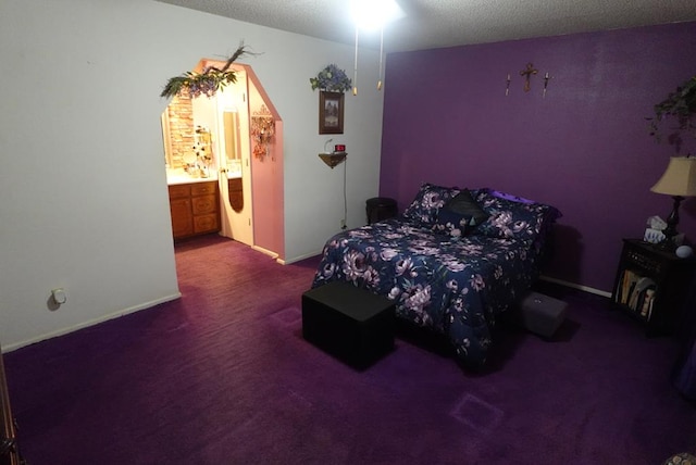 2511 Fontana St, Odessa, TX 79763 - bedroom featuring carpet, a textured ceiling, and connected bathroom