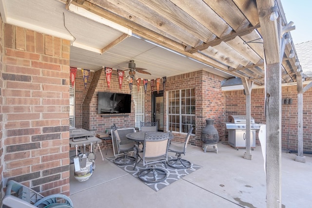 view of patio with ceiling fan, outdoor dining area, and area for grilling