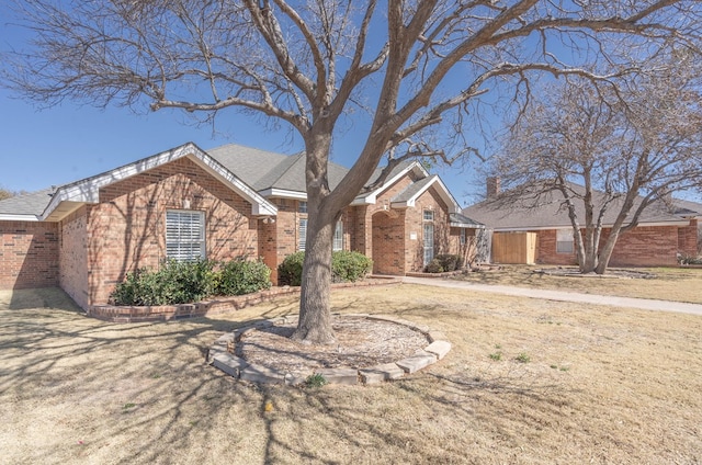 ranch-style house with brick siding